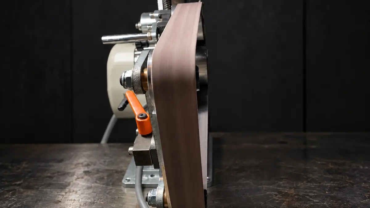 Belt grinder in the workshop